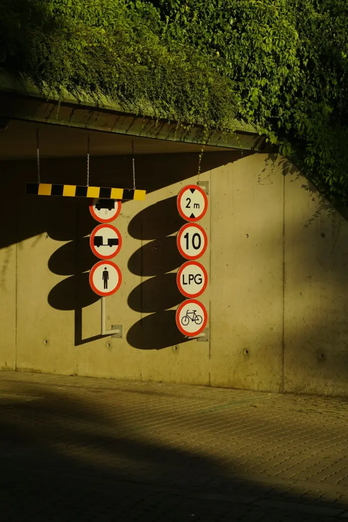Road signs are illuminated by sunlight.